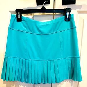 JoFit tennis/golf skirt. Size XS. Bright blue. Side ruffle pleats